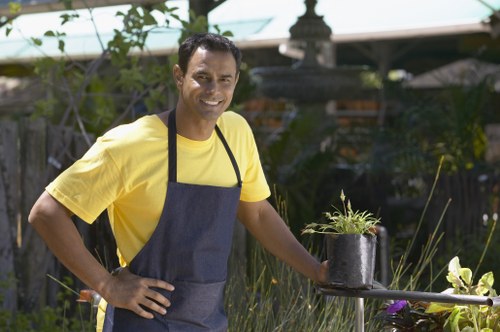 Professional gardeners maintaining a healthy garden in Wealdstone